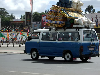 Overloaded blue minibus