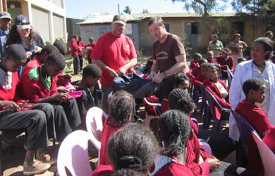Handing out pencils and pencil cases - Dean Miles and Ian Bell